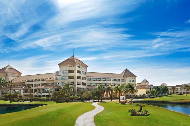 Hotel Exterior Daytime, Ponds and Foot Path