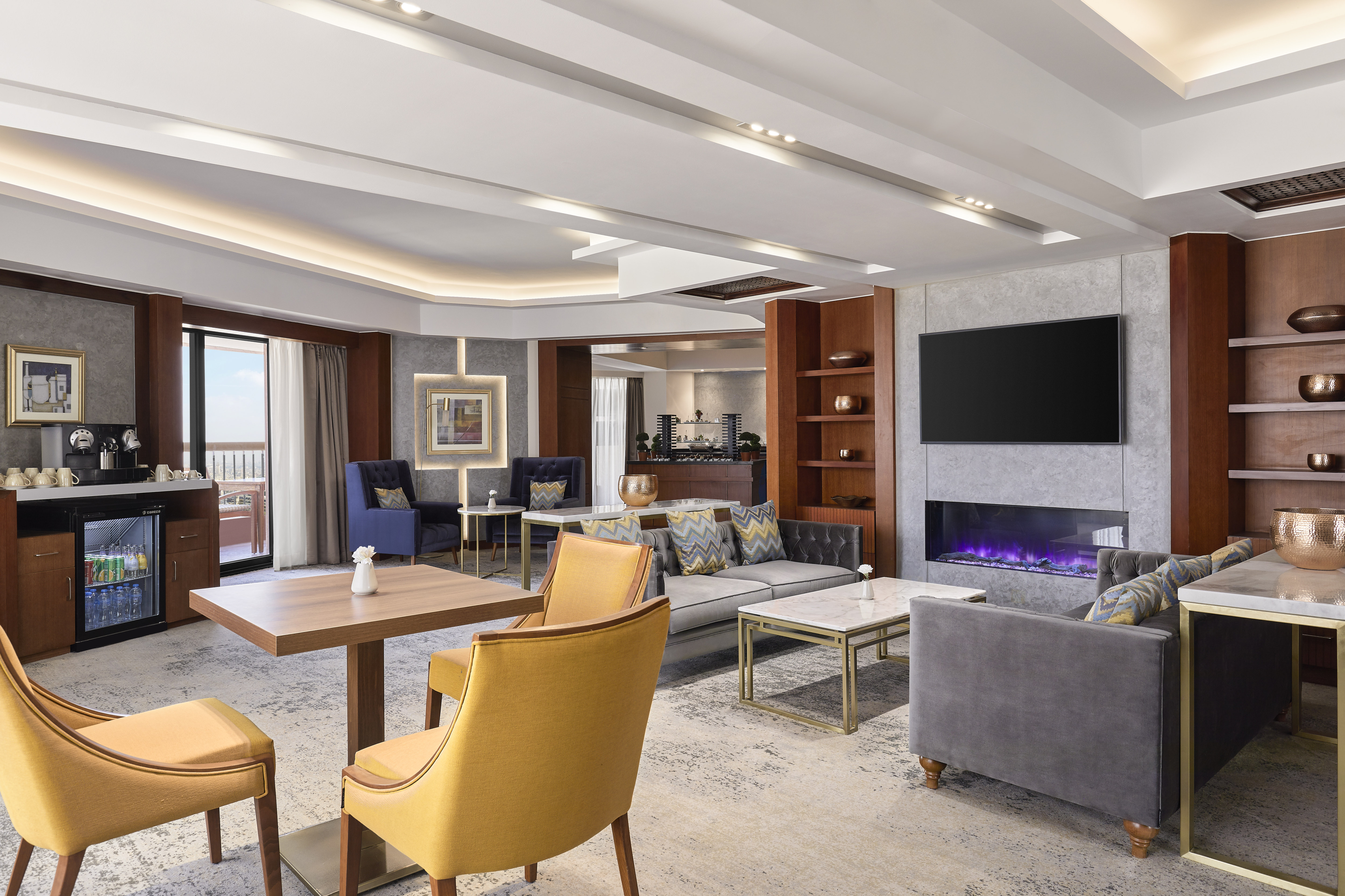 Executive Lounge with Wet Bar, Fireplace, and TV