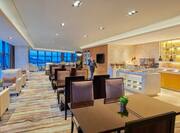 executive lounge with tables and breakfast area