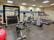 24 Hour Fitness Center with Recumbent Bikes Treadmills and Weights