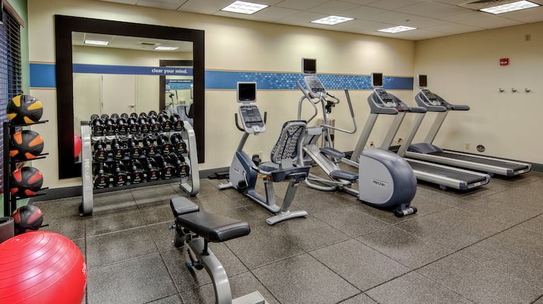 24 Hour Fitness Center with Recumbent Bikes Treadmills and Weights
