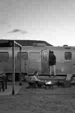 Two people by a campfire