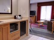 Guestroom Suite with Kitchenette, Lounge Area, and Room Technology
