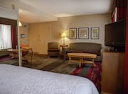 Accessible King Guestroom with Bed, Lounge Area, Room Technology, and Work Desk