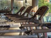 Close up View of Treadmills in Fitness Center with Large Windows