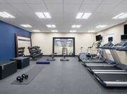 Cardio Equipment and Weights in Fitness Center