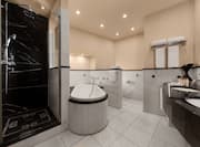 Dual Vanity Area Bathtub and Separate Shower in Hotel Suite