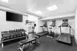fitness center with weights and treadmills