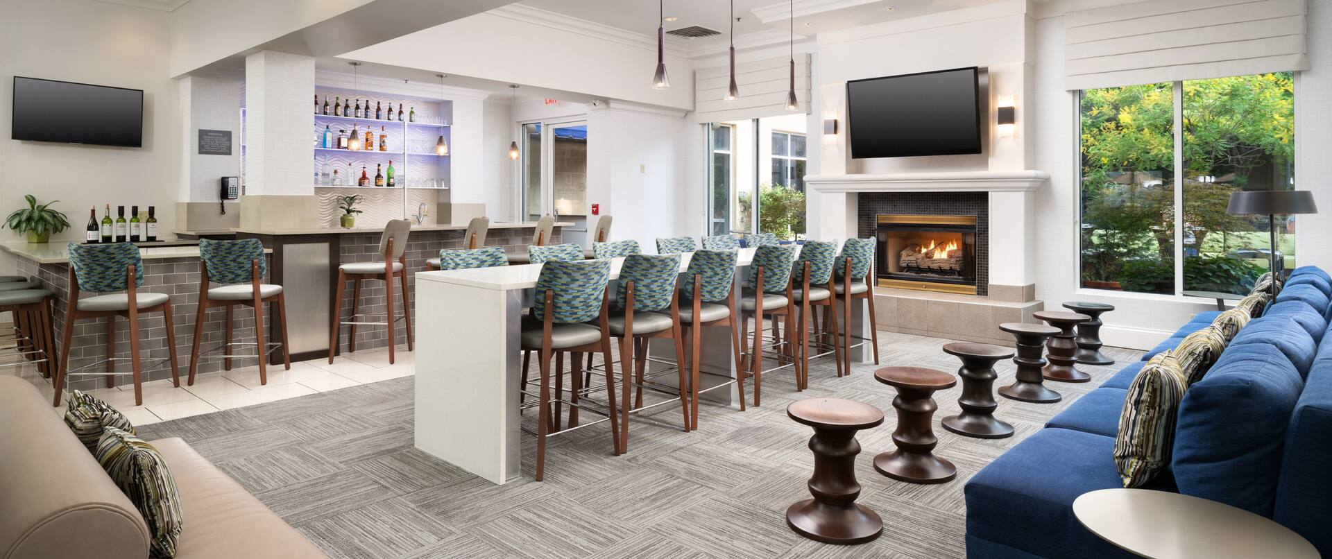 Lobby Area with Large Sofa Table and Chairs TVs and Fireplace