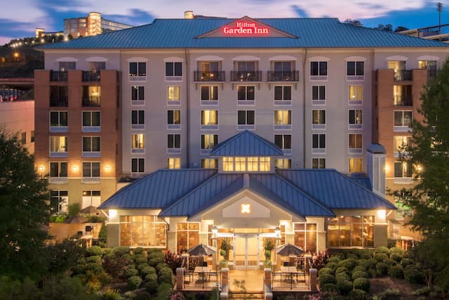 Modern hotel exterior surrounded with trees