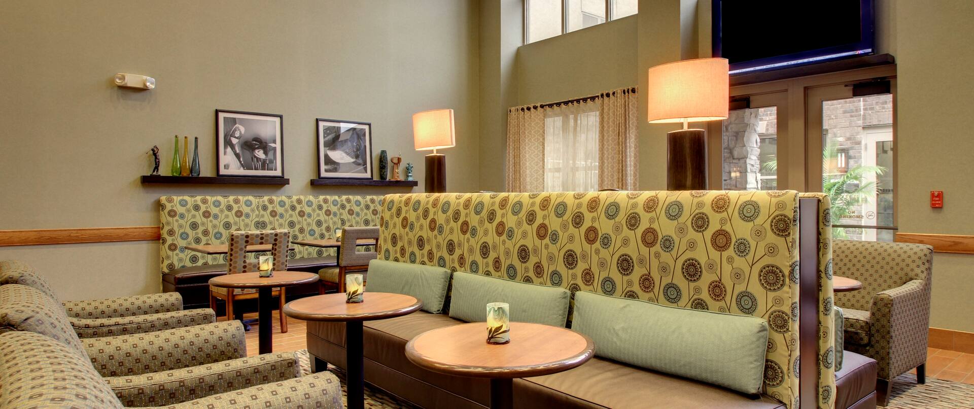 Tables, Chairs, and Booth Seating in Breakfast Lounge Area