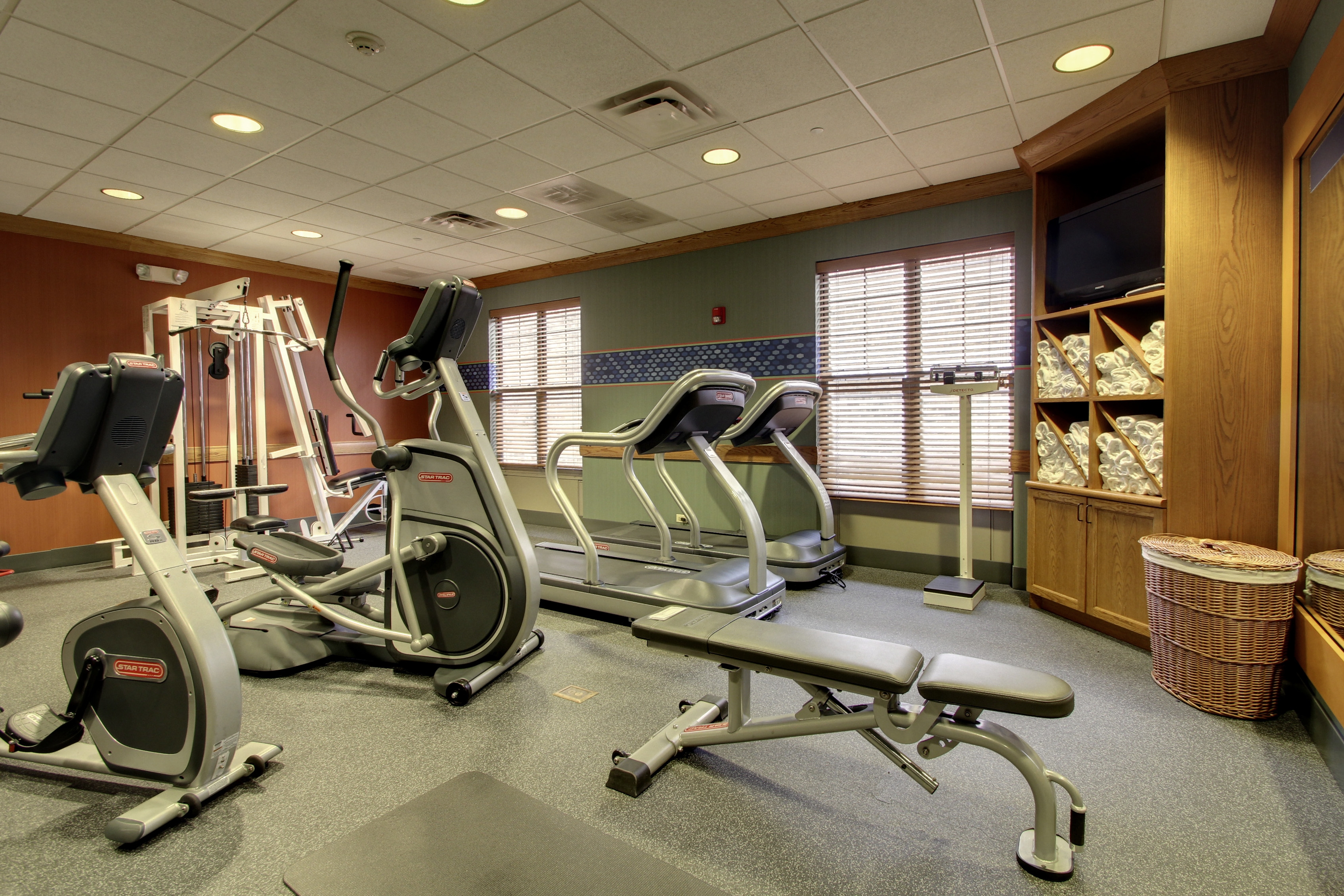 Fitness Center With Weight Bench, Cardio Equipment, Towel Station, and Wight Bench