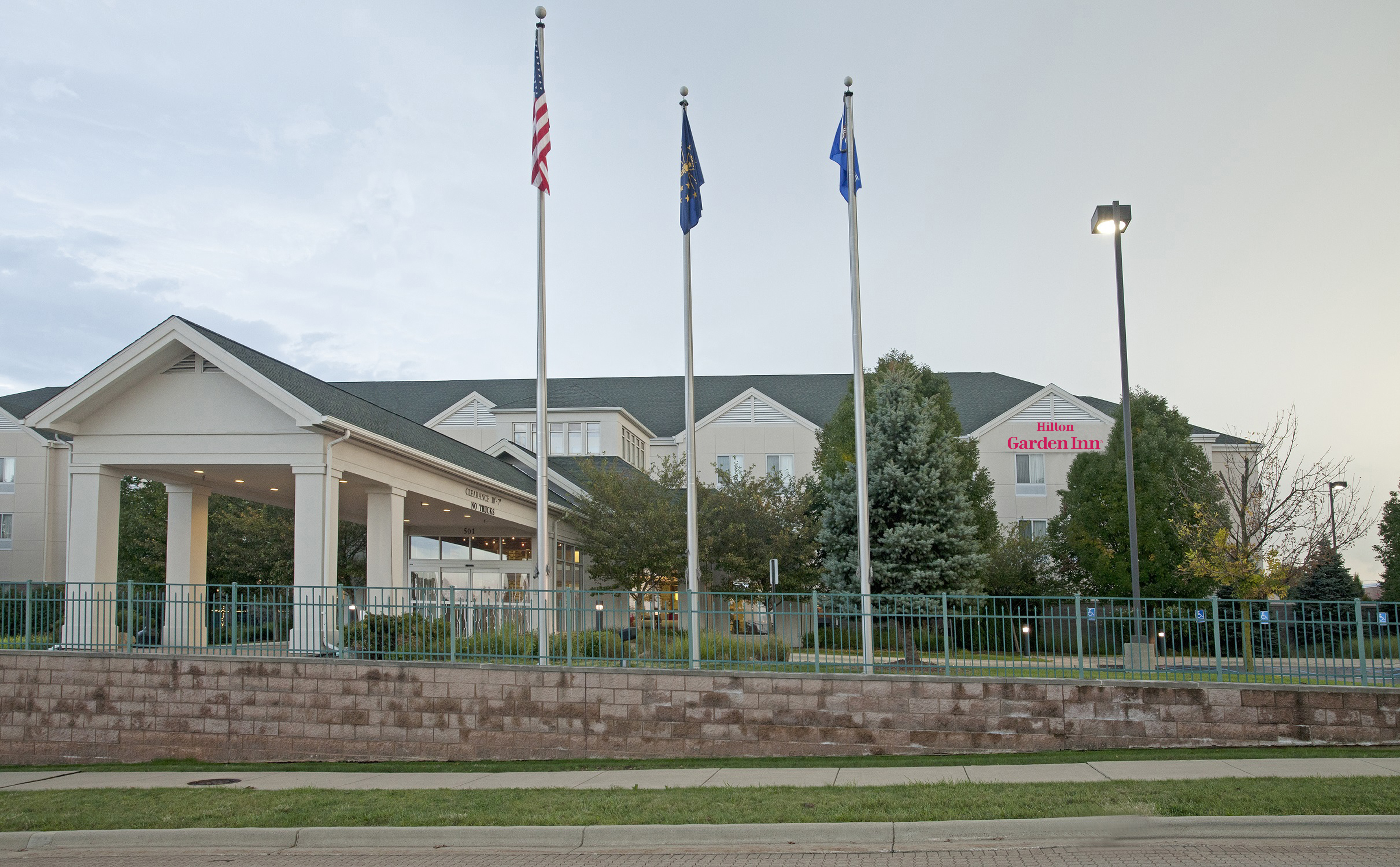 Hotel exterior with entrance and flags