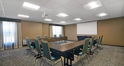 meeting room with U shaped table and seating