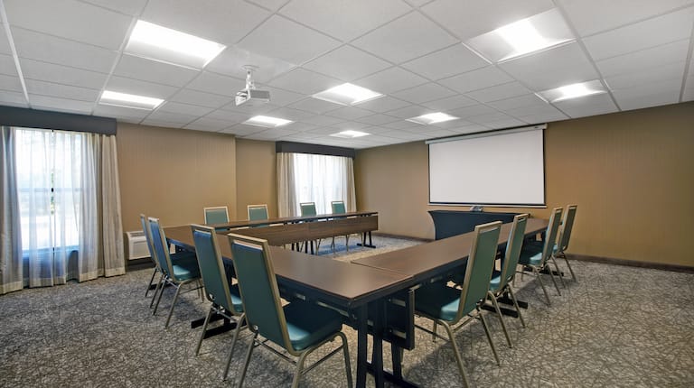 meeting room with U shaped table and seating