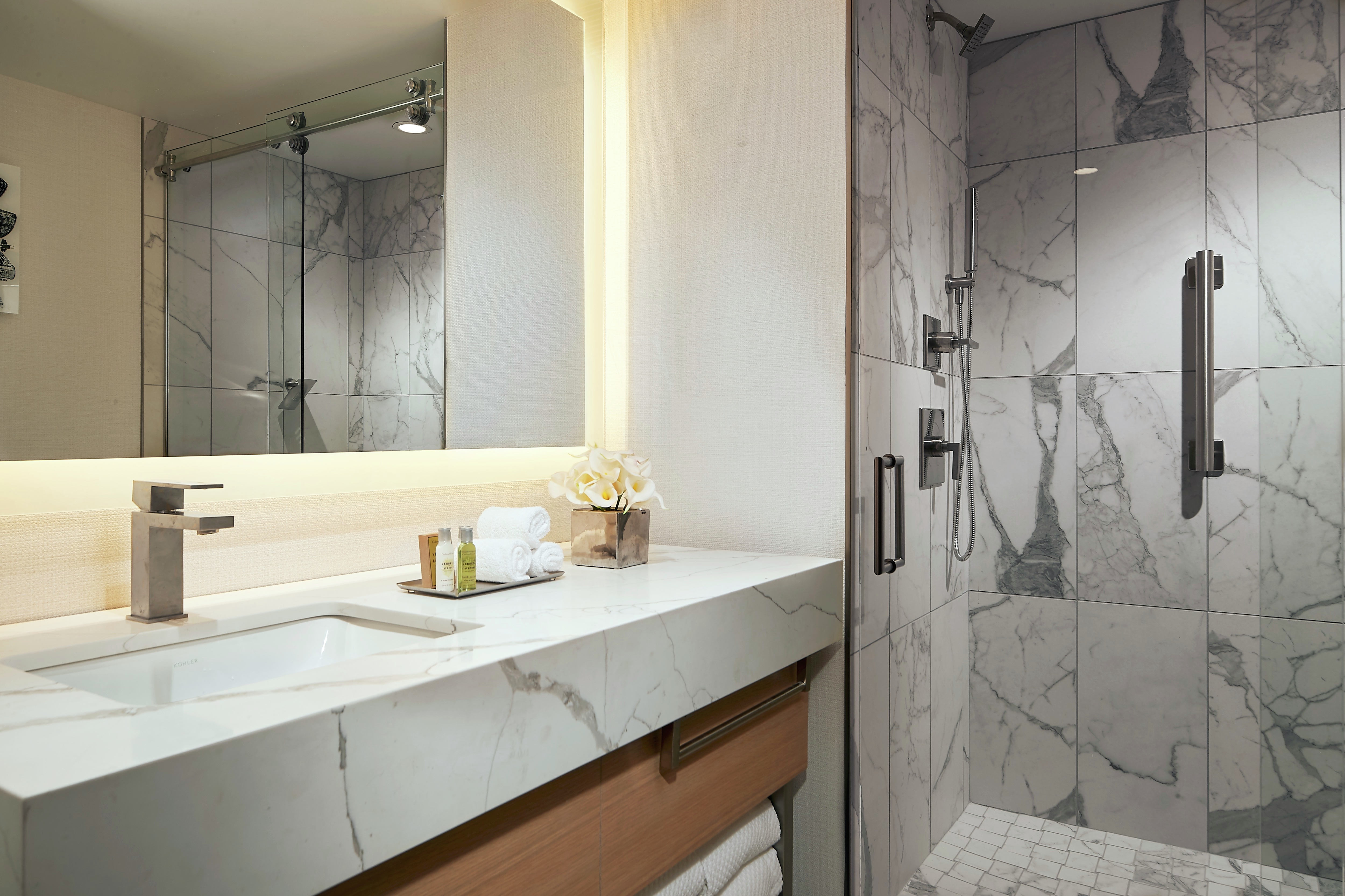 White Marble Sink Vanity and Walk-in Shower