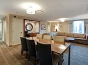 Suite living area with tables and chairs