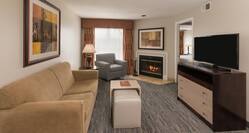 Guest Suite Living Area with Sofa, Fireplace, and HDTV 