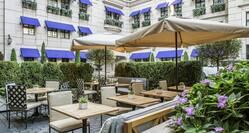 Hotel Courtyard - Tables, Chairs and Umbrella