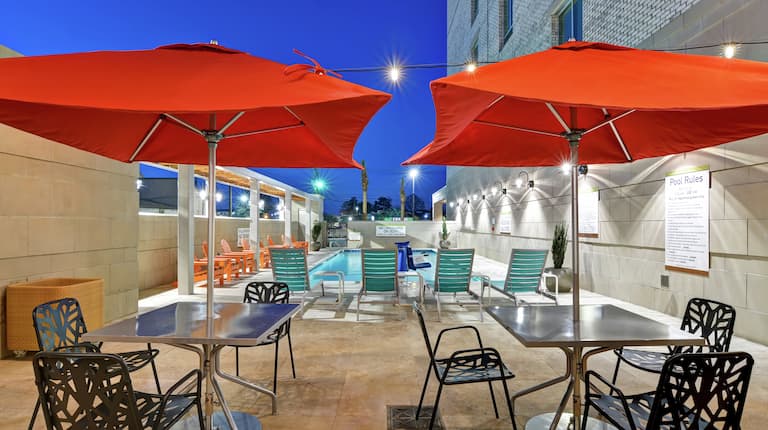 Poolside Patio with Tables and Umbrellas