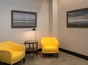 Business Center Sitting Area with Soft Yellow Chairs