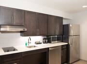 Accessible Suite Kitchen with Refrigerator, Dishwasher, Sink, Microwave and Stove