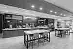 Breakfast Buffet Area with Food Preparation Counters and Dining Tables
