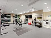 Fitness Center with Weight Bench, Treadmill and Weight Machine