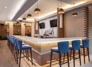 Convenient in lobby bar featuring stylish design, TVs and beer on tap.