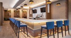 Convenient in lobby bar featuring stylish design, TVs and beer on tap.