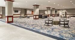 Spacious pre-function area featuring ample seating, TV's, and stylish design.