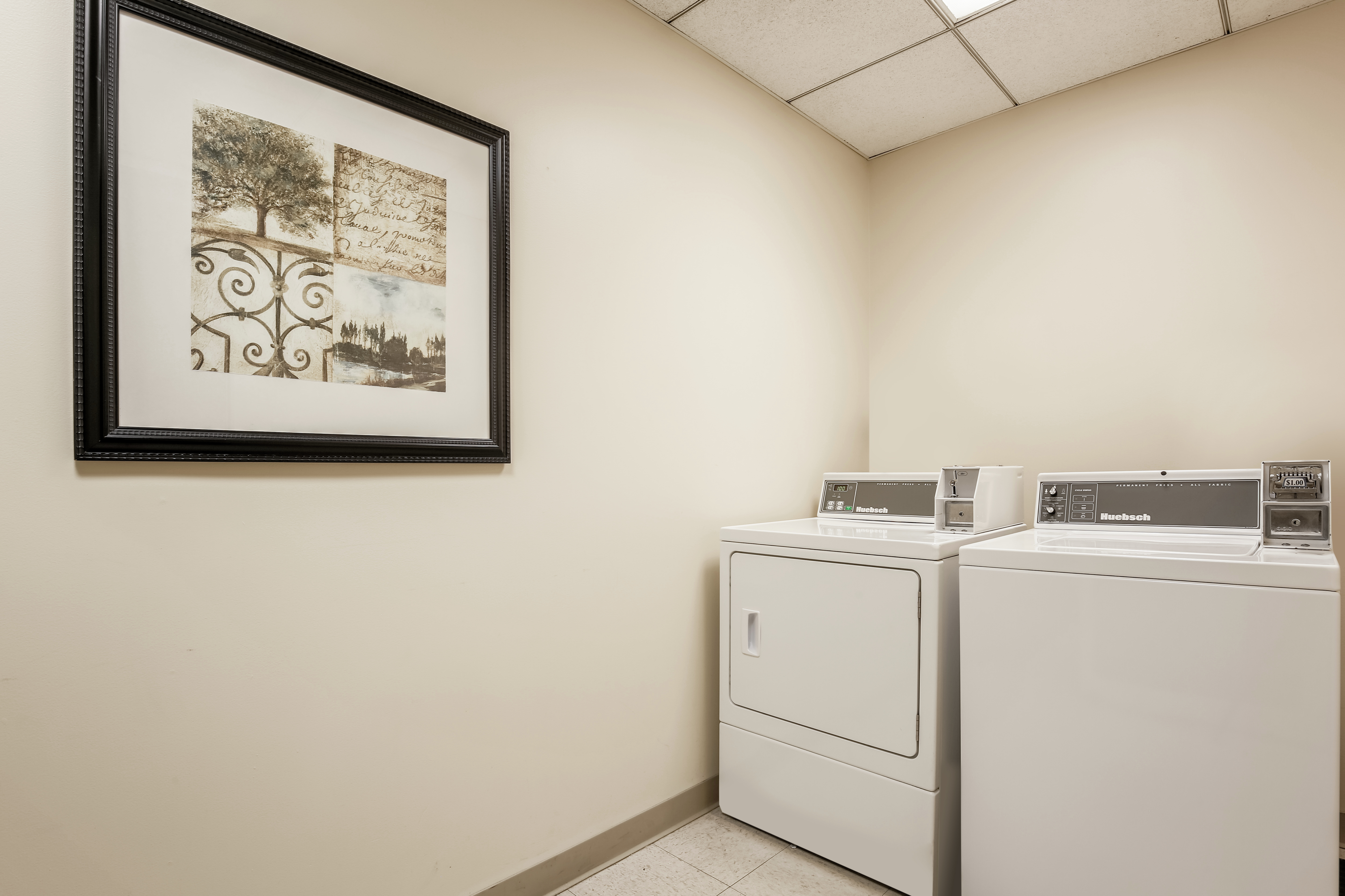 Guest Laundry Room With Coin-Operated Washer And Dryer 