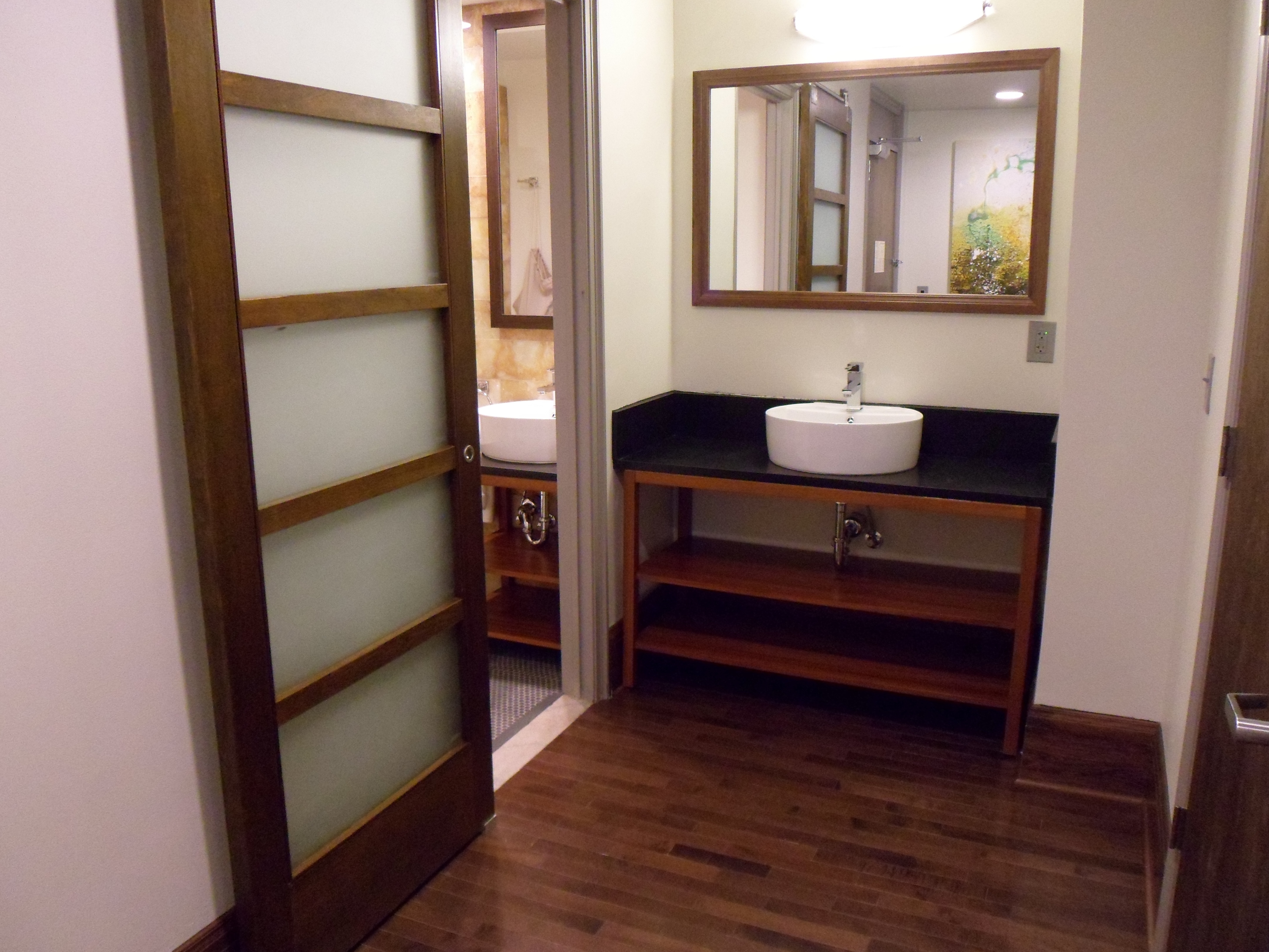 Bathroom Vanity Area with Large Mirror