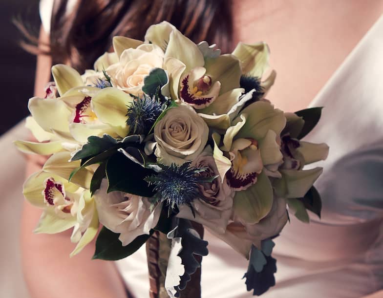 Close up of a bride holding her bouquet.