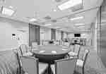 Mockingbird meeting room set with dark gray round tables and gray chairs