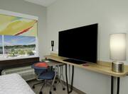Guestroom with Bed, Work Desk and Television