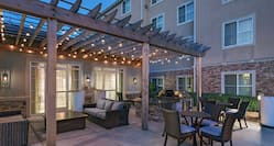 Outdoor Patio and Lounge Area with Pergola Overhang 