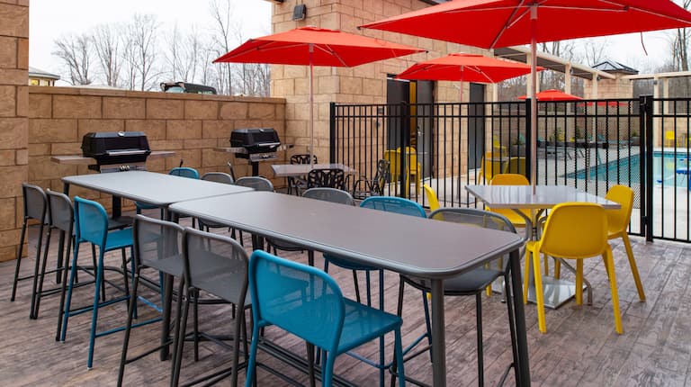 Outdoor patio area with tables and chairs