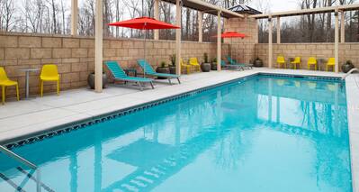 Outdoor pool with loungers and chairs