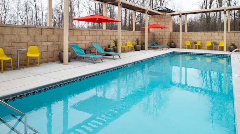 Outdoor pool with loungers and chairs