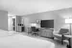 guest room, 2 queen beds, work desk, tv, lounge chair