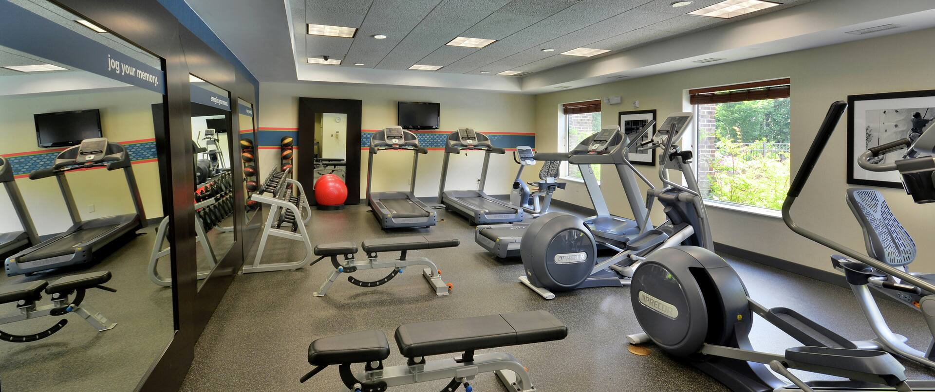 Fitness center with weight benches and cardio machines