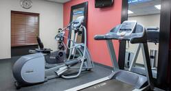 Fitness Center with Treadmill, Cross-Trainer, Cycle Machine and Wall-Mounted TV