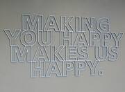 Making You Happy Makes Us Happy Sign on Wall