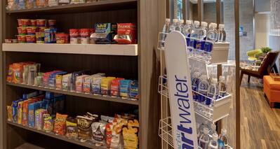 snack shop with various snacks and water
