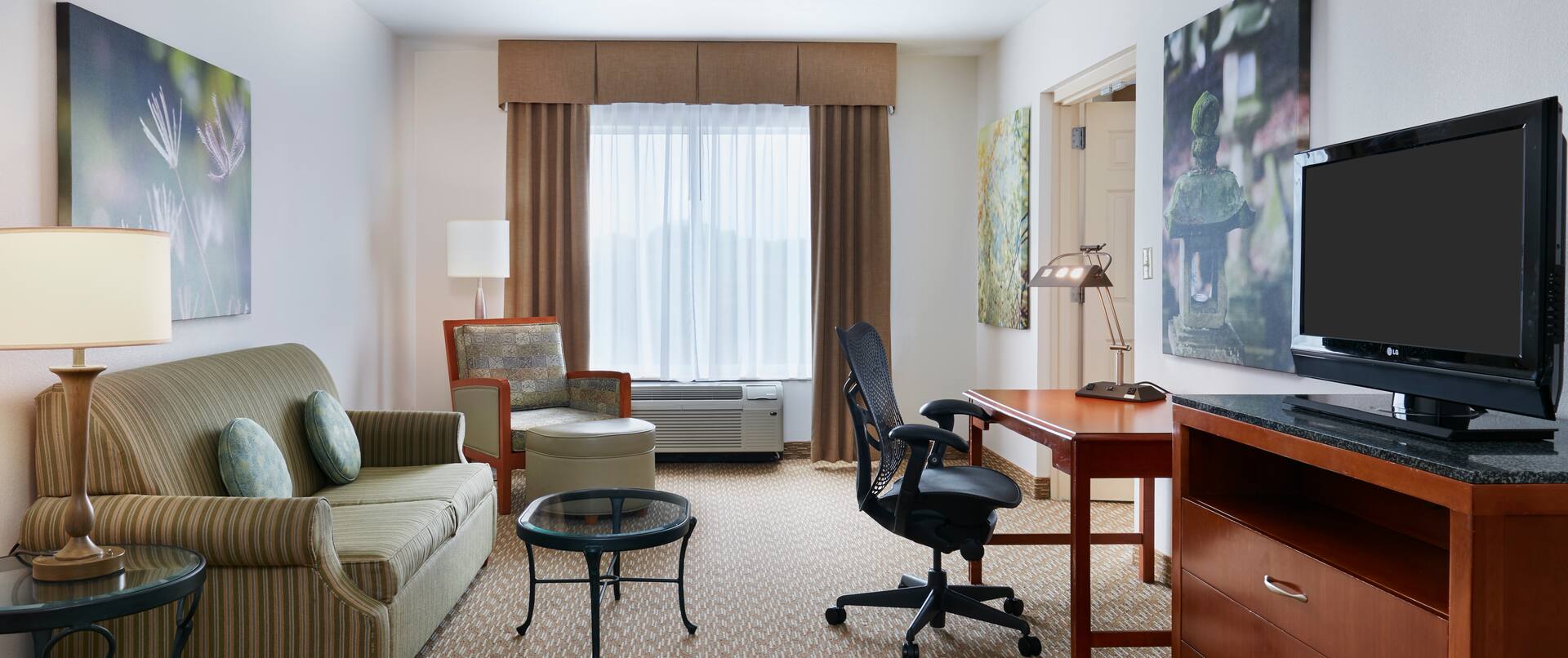 Accessible King Guestroom Suite with Lounge Area, Work Desk, and Room Technology