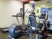 Fitness Center with Elliptical Machines, Treadmill, and Mirror