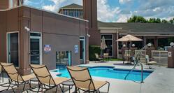Exterior Heated Pool with Lounge Chairs