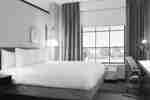 Stunning guest room featuring a king bed and functional work desk