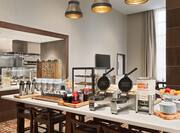Breakfast Buffet Area with Waffle Makers and Cereal Dispensers